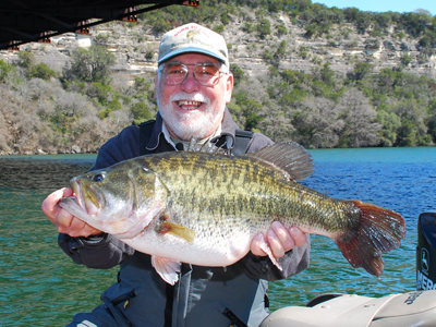 Carl Adkins of San Marcos caught Toyota ShareLunker 481 from Lake Austin Feb. 27. The fish was 25 inches long and 21.125 inches in girth. Photo by Larry Hodge, Texas Parks and Wildlife.