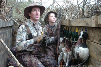 Scott Nelson and his son, Dylan, 13, watch the skies while duck hunting on the last day of the season. Photo by David J. Sams, LSONews.com.