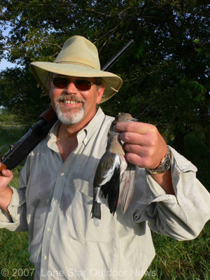 Steve Faris poses with his first White-winged dove taken near Waco. Photo by David J. Sams