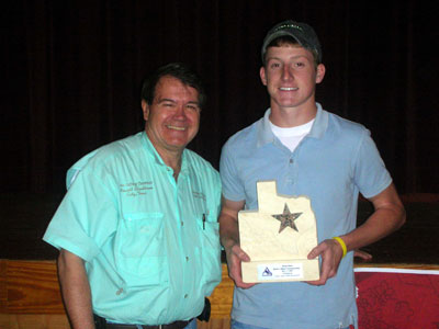 Clint Parker Johnson, right, holds his trophy presented by Newell Cheathdam for winning the Texas State Championship Duck Calling Contest. Clint Parker Johnson, right, holds his trophy presented by Newell Cheathdam for winning the Texas State Championship Duck Calling Contest.