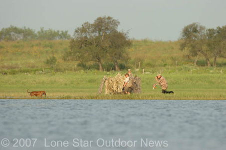 Phillip Monier takes photos of a retrieve. Photo by David J. Sams